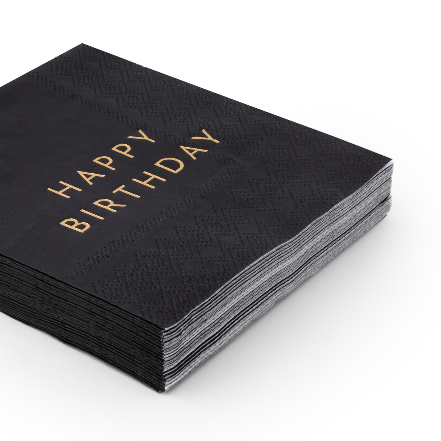 Stack of black Happy Birthday cocktail napkins with gold foil lettering and embossed detail