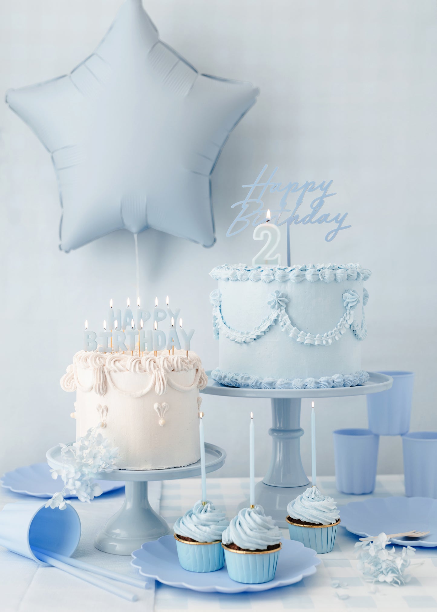 Light blue Happy Birthday candles styled on elegant birthday cakes available in Toronto and shipping across Canada