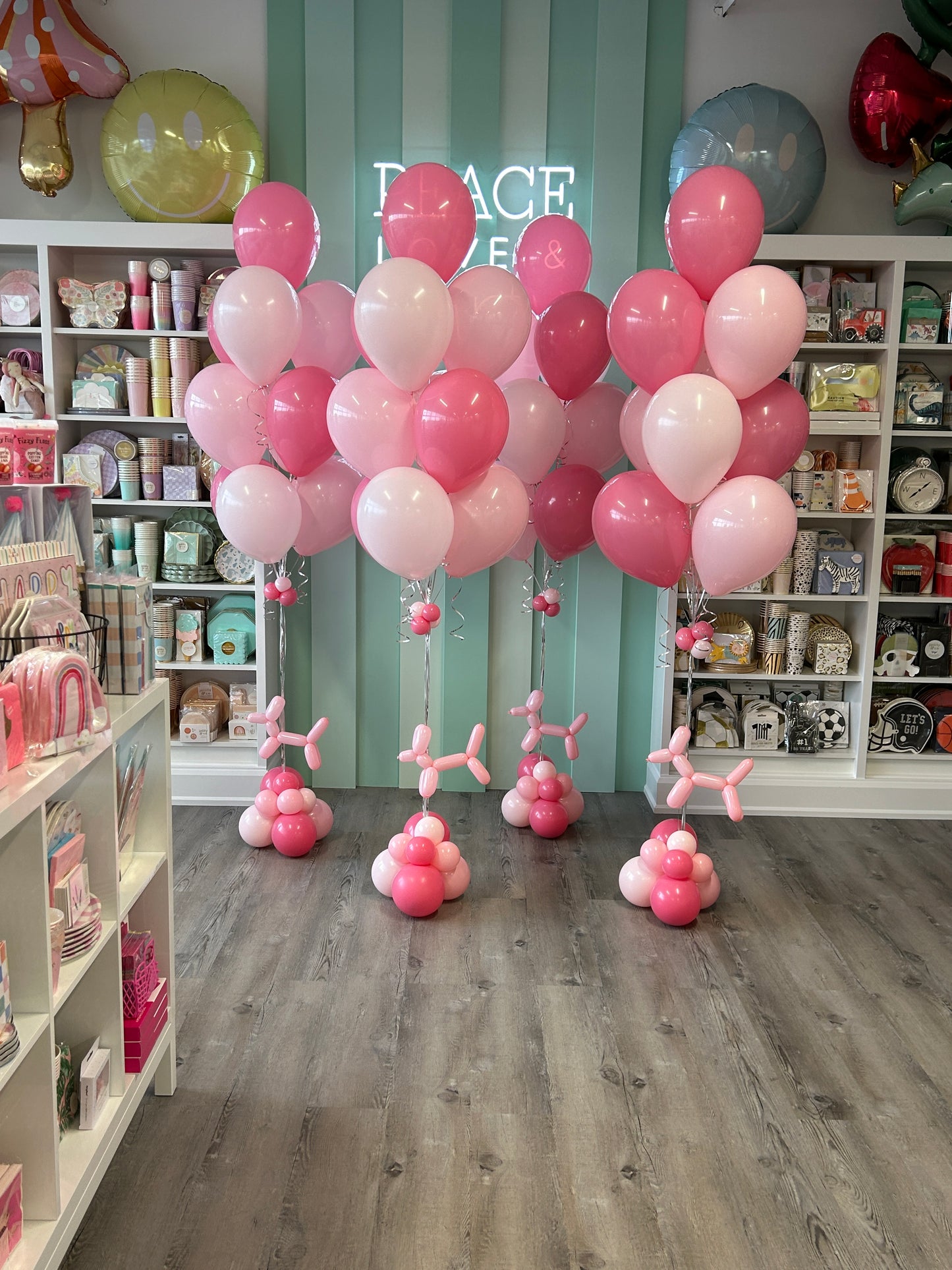 pink and hot pink helium balloon bundles arranged in clusters with layered tones, perfect for birthdays and events in Toronto.