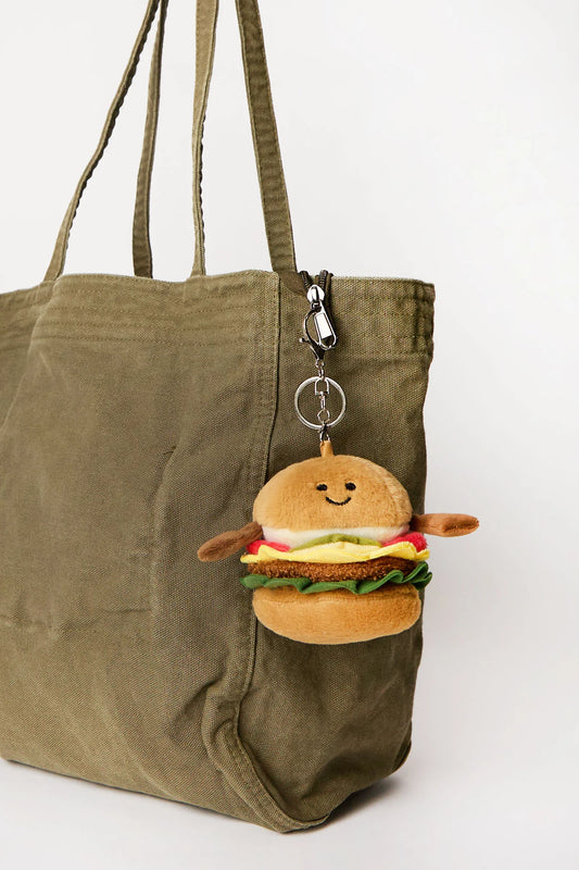 Burger plush keychain charm clipped onto tote bag available in Toronto and shipping across Canada