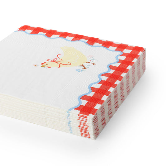 Stack of countryside farm cocktail napkins with hen illustration and red gingham border.