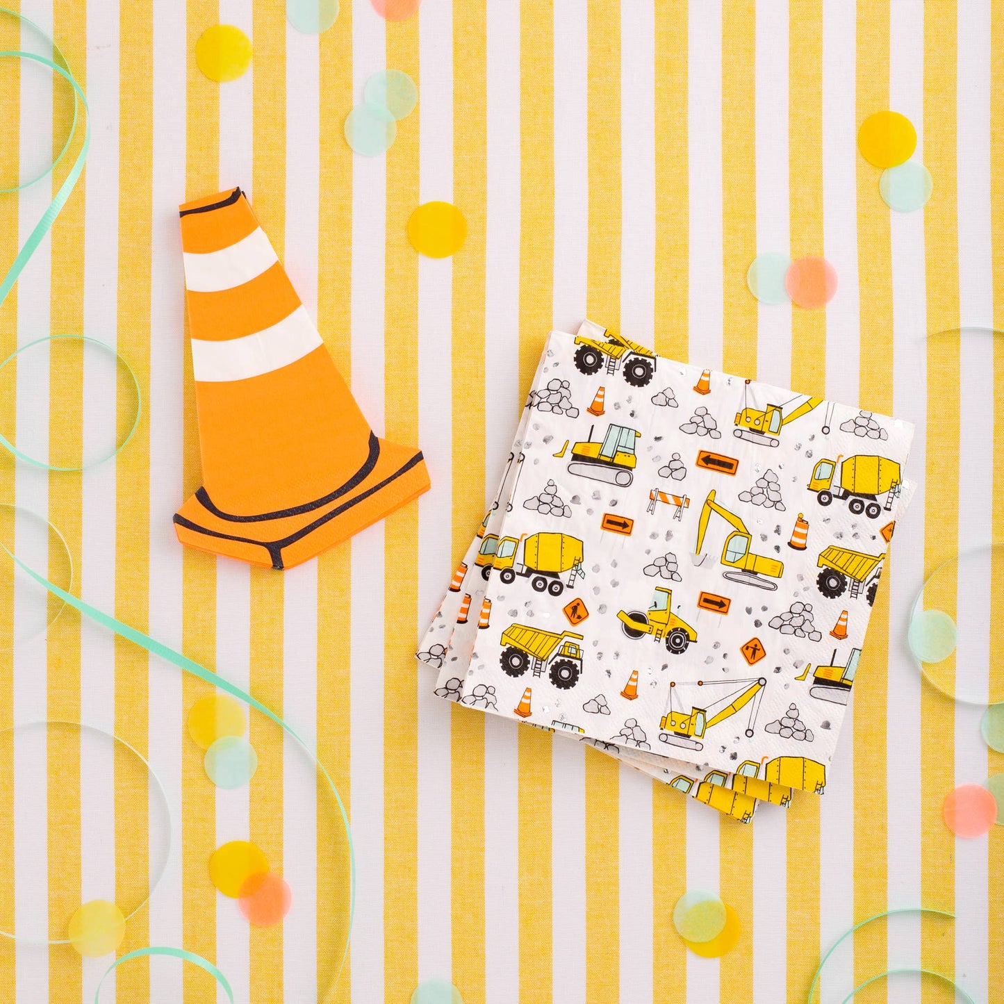 Construction-themed dinner napkins with yellow trucks and roadwork icons styled for a kids construction birthday party from My Minds Eye, sold at Confetti My Party Toronto