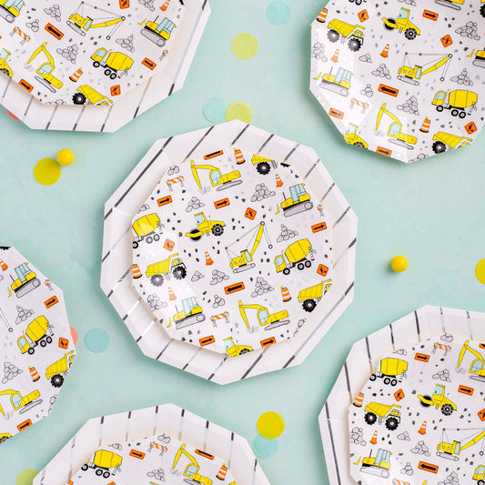Construction-themed small plates with yellow trucks and roadwork icons styled for a kids construction party from Confetti My Party Toronto