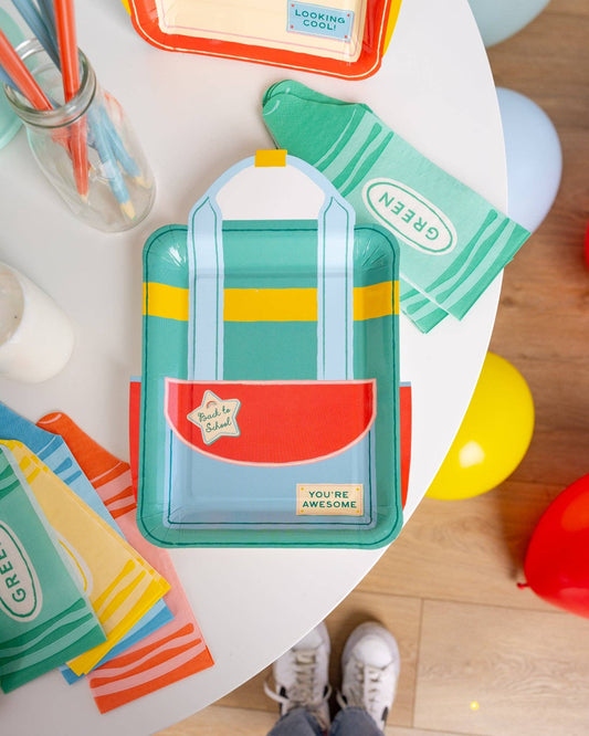 Crayon box shaped napkins styled with colourful school themed party supplies available at our Toronto party shop.