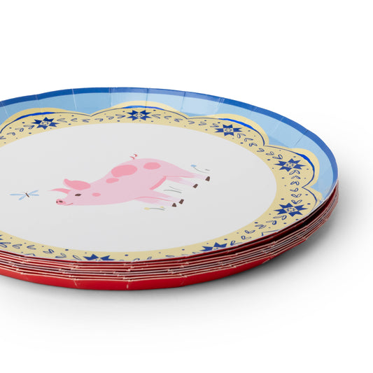 Close-up of colourful farm animal paper plate featuring a pink pig with decorative scalloped