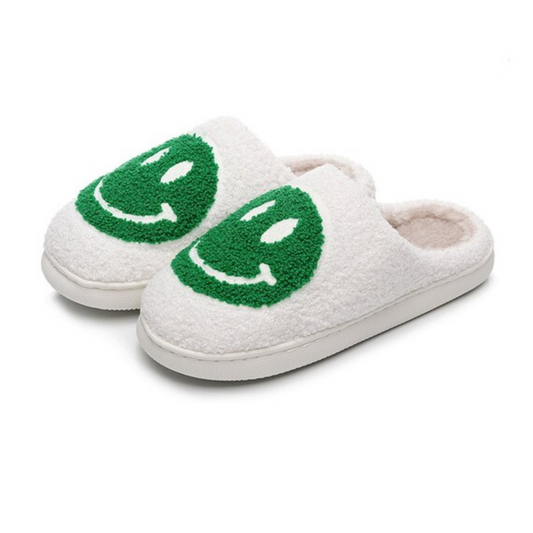 green and white fuzzy happy face slippers