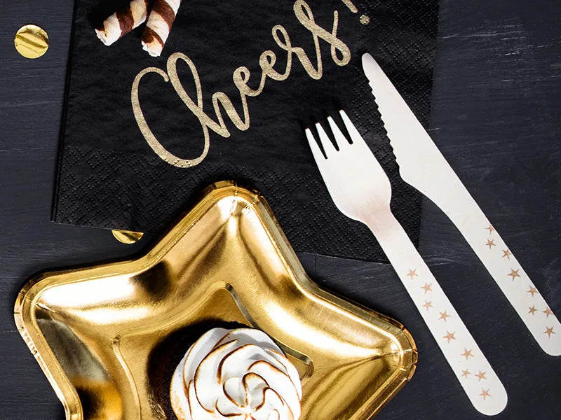 gold and black new years eve table setting