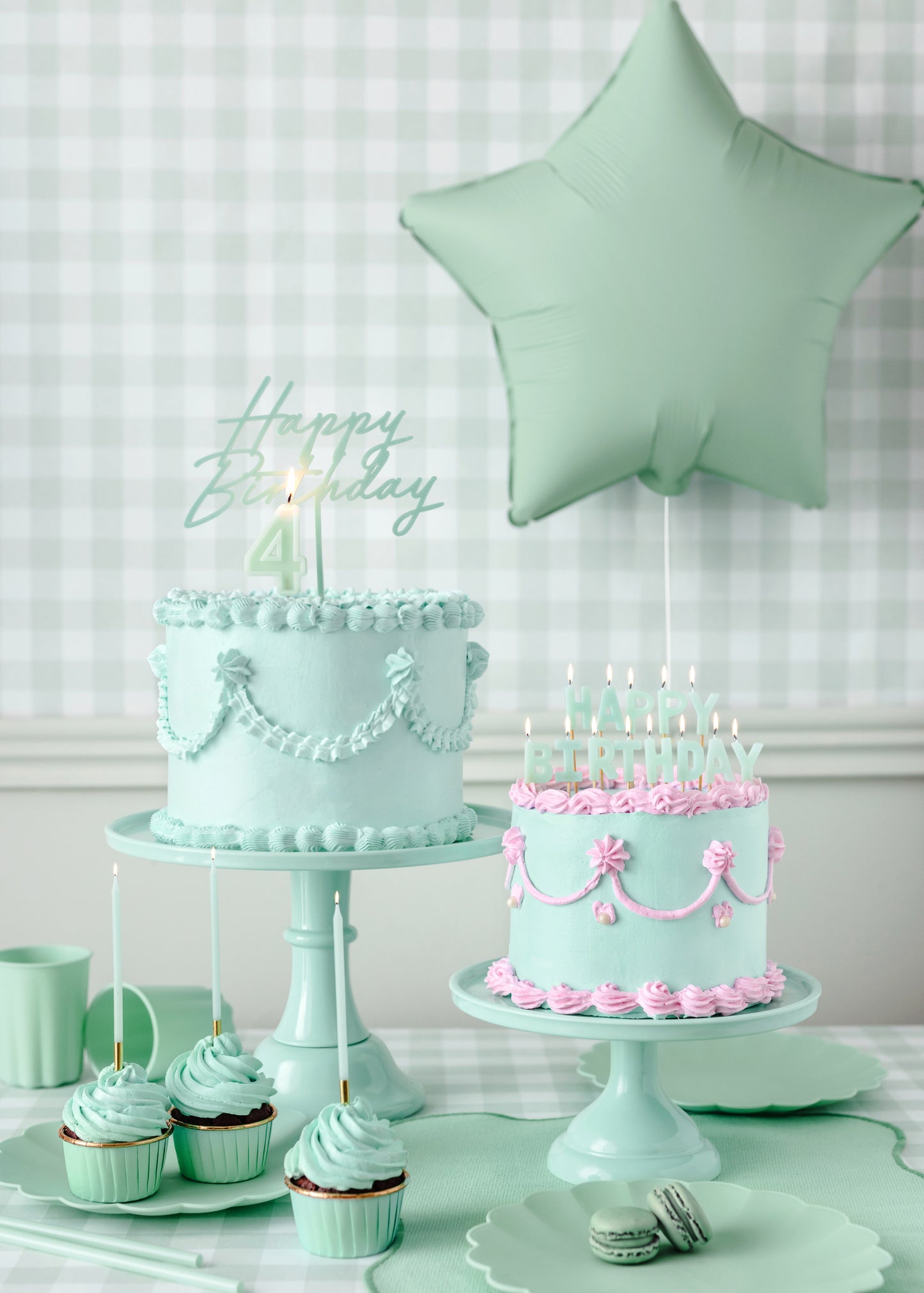 green reusable happy birthday cake topper on a pipped green cake