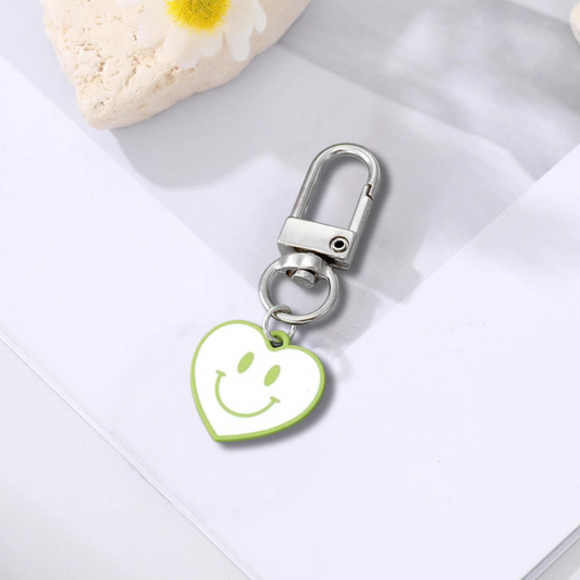 white and green heart shaped happy face keychain