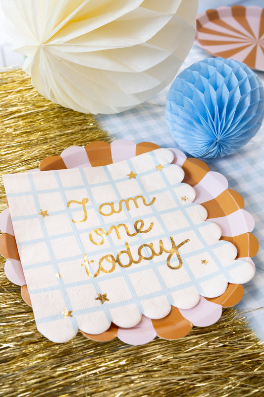 ‘I Am One Today’ scalloped paper napkin with gold foil lettering on blue check pattern, perfect for first birthday parties in Toronto.