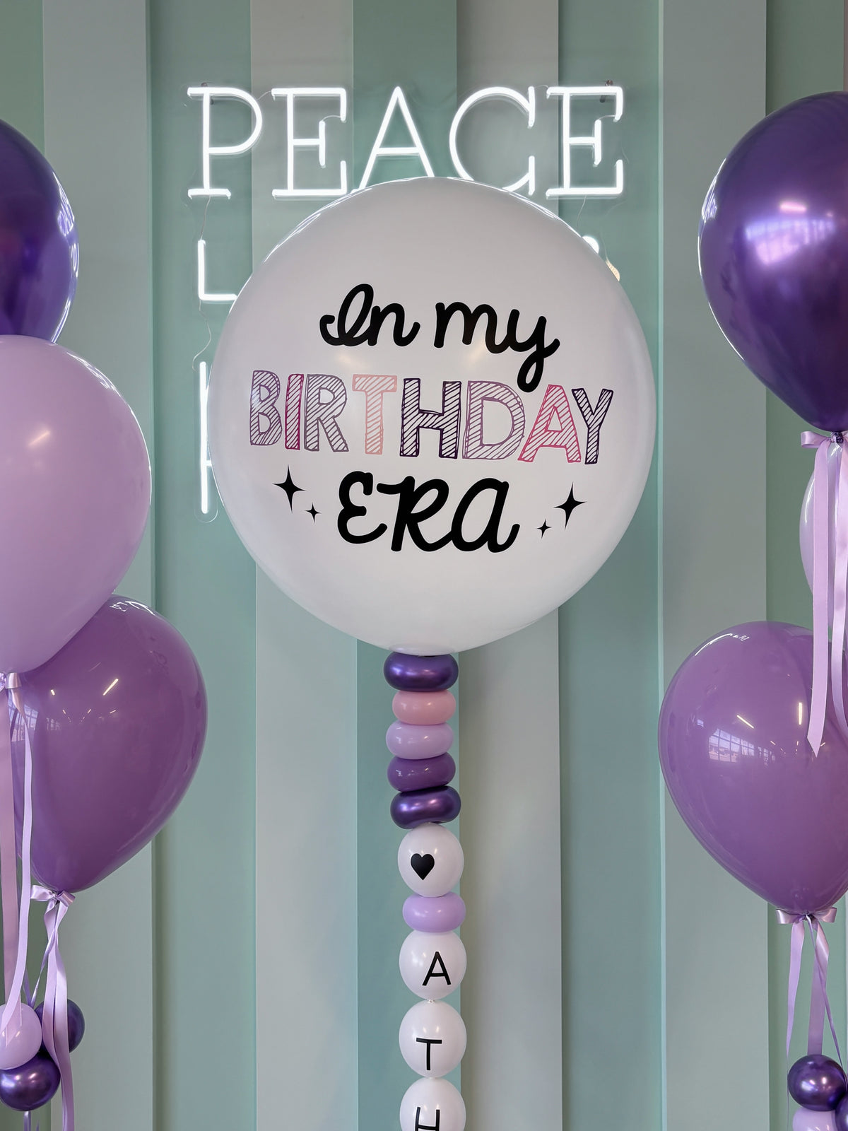 Lavender and purple “In My Birthday Era” jumbo balloon bundle with custom name column, styled in our Toronto balloon shop for birthday celebrations