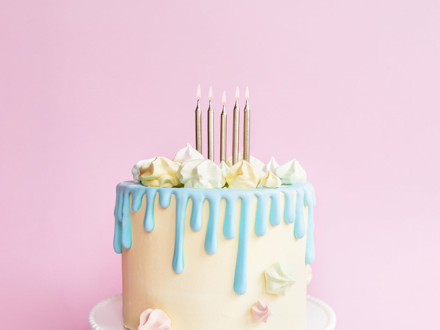 Tall metallic gold candles on pastel drip cake, styled and sold at Confetti My Party Toronto