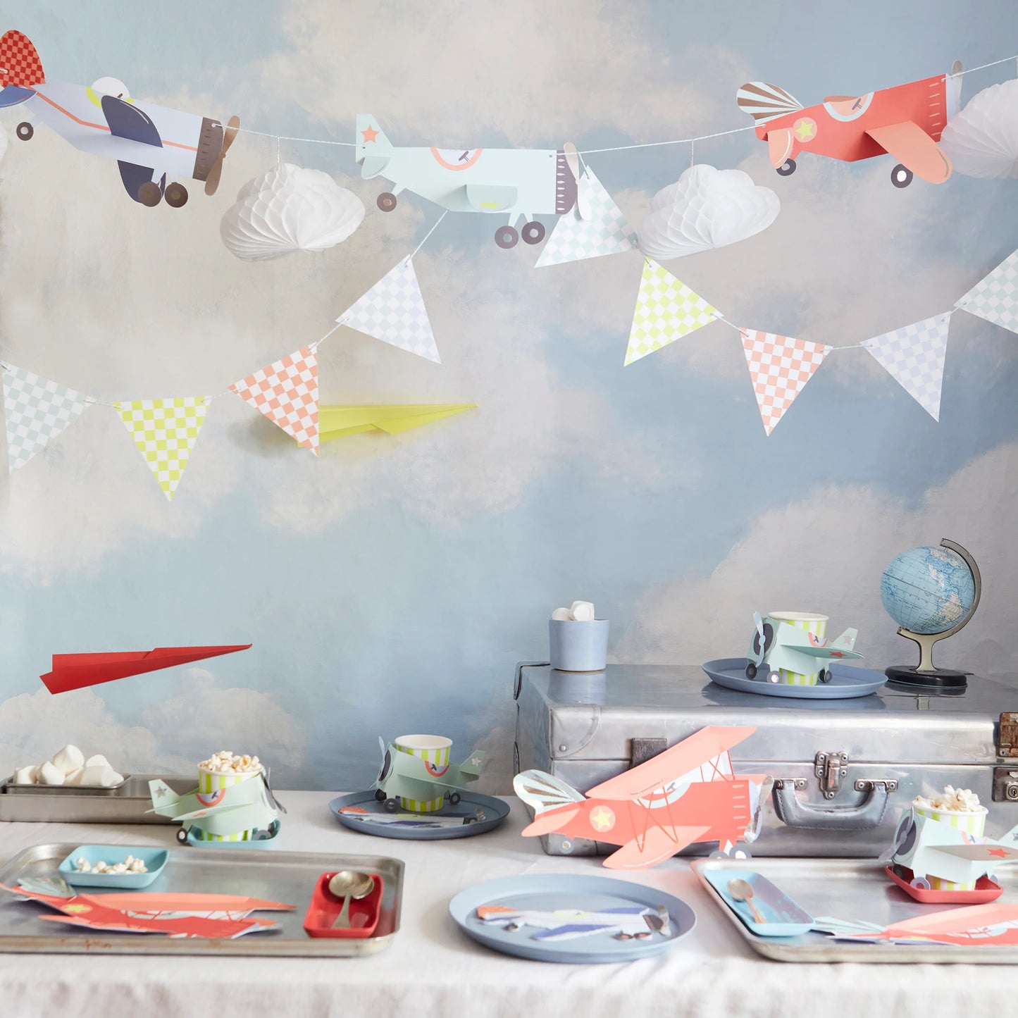 Aviation birthday party setup featuring Meri Meri planes garland with coordinating tableware, available at our Toronto party shop.