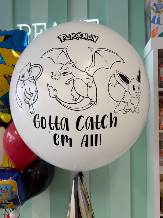 Close-up of jumbo Pokémon birthday balloon with “Gotta Catch ’Em All” design for a Toronto kids birthday celebration.