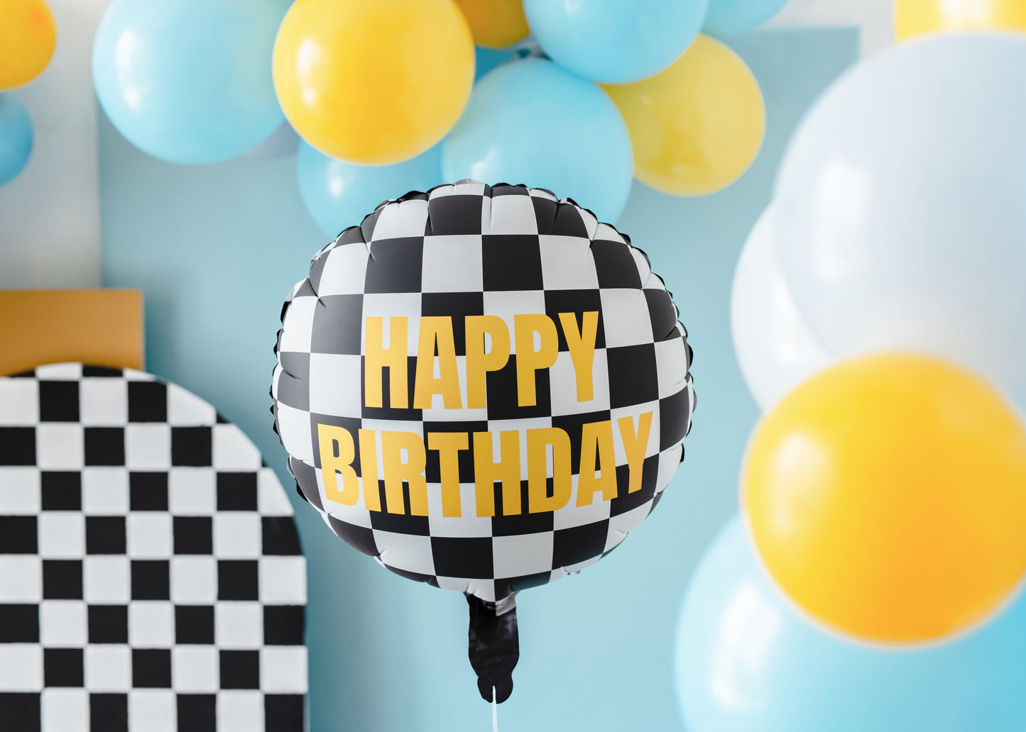 Race-car themed checkered Happy Birthday balloon styled with colourful latex balloons, sold in Toronto at Confetti My Party. Ships across Canada.