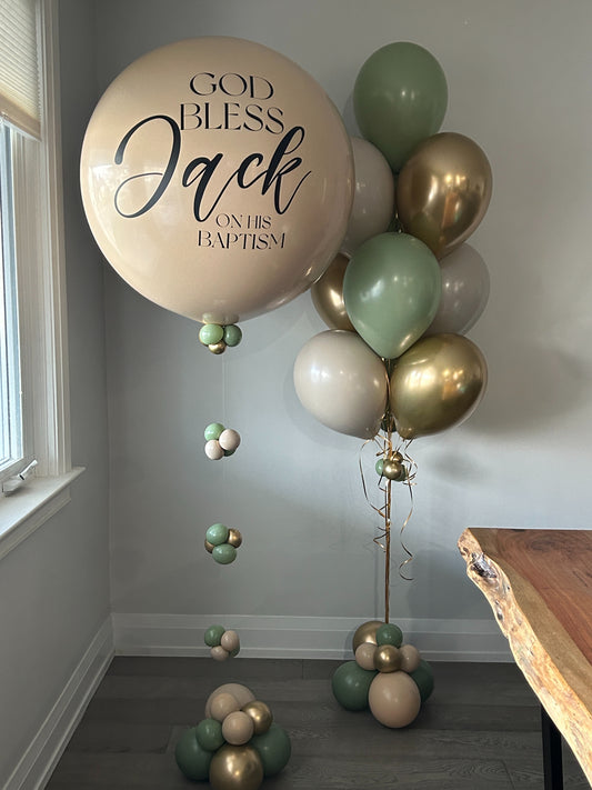 Personalized sacrament jumbo balloon bouquet with sage green and gold balloons available at our Toronto party shop