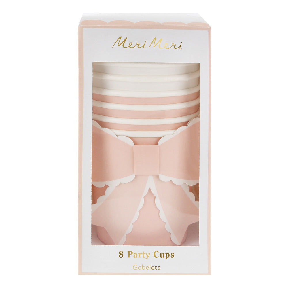 Scalloped bow party cups by Meri Meri in blush pink packaging available at our Toronto party shop
