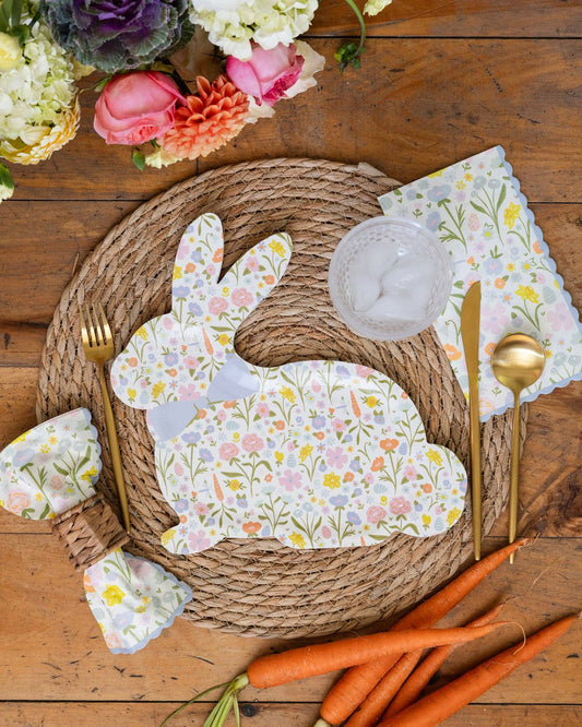 Floral bunny Easter plates styled on a spring table with woven placemats, gold cutlery, and fresh florals
