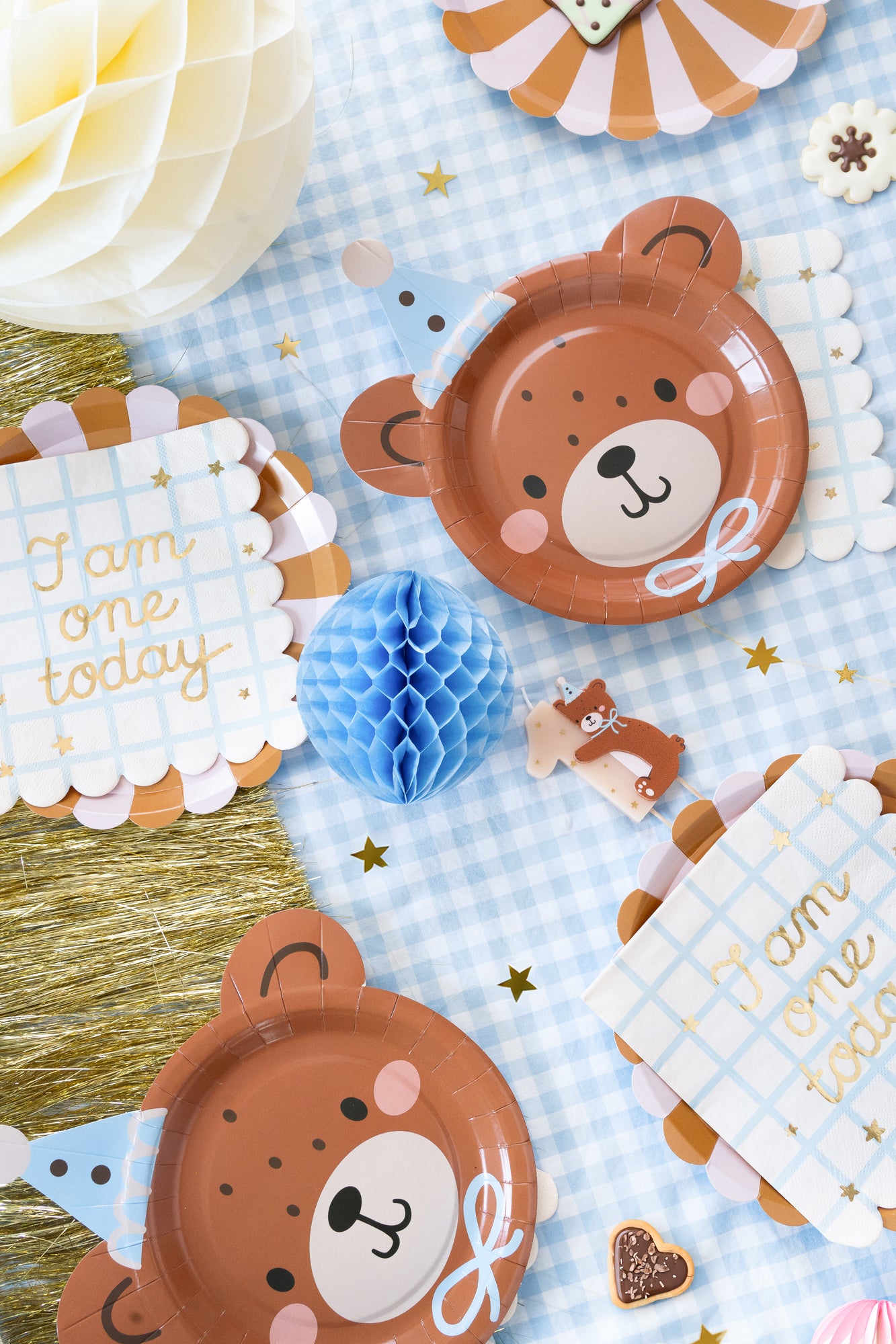 Teddy bear-themed first birthday table setup with ‘I Am One Today’ scalloped napkins, bear plates, and party decor, perfect for celebrations in Toronto.
