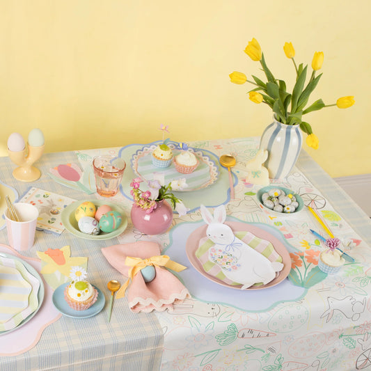 Meri Meri pastel wavy round paper placemats shown on an Easter table setting available at our Toronto party shop