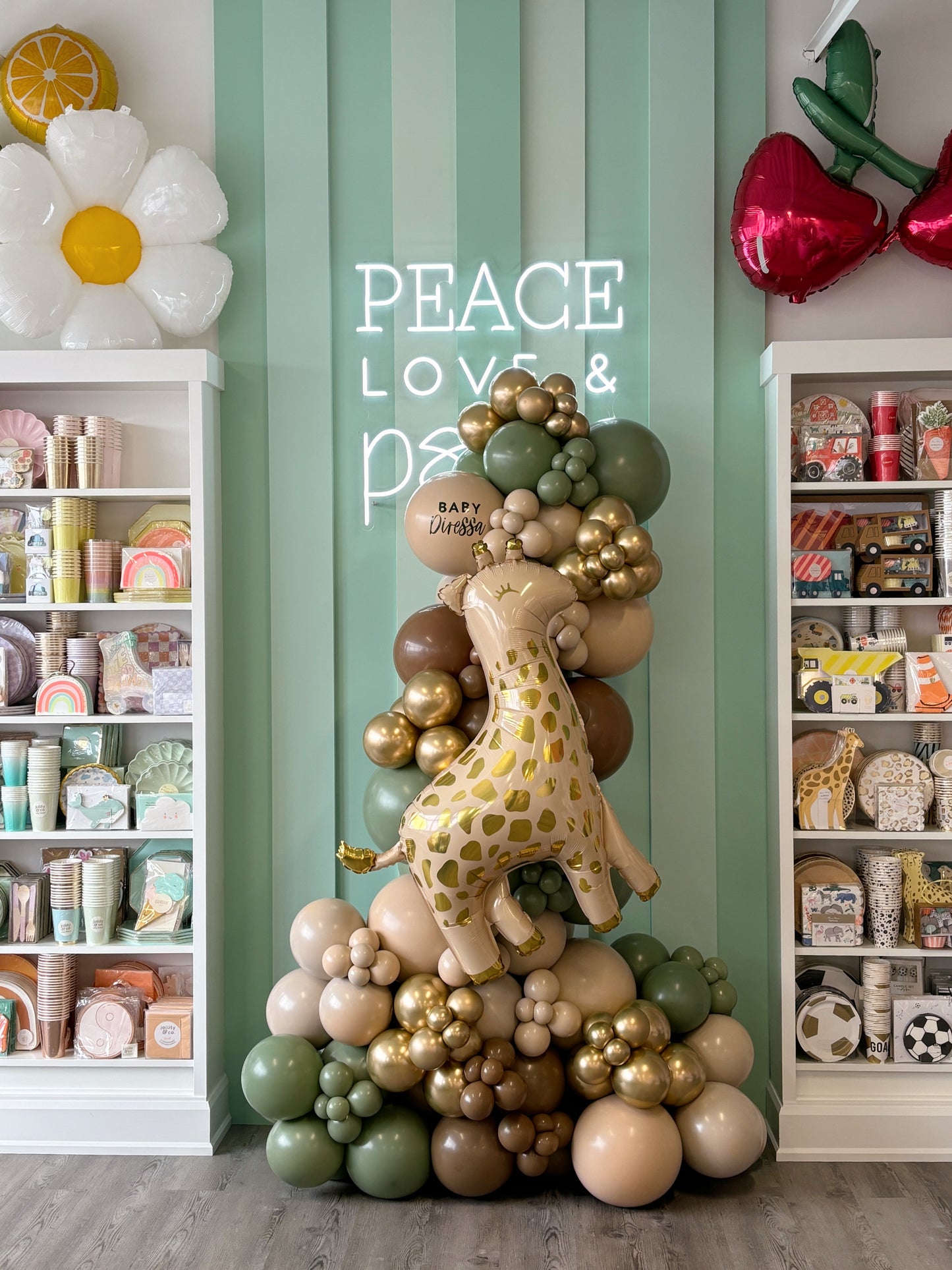 welcome baby balloon garland in nudes, eucalyptus and gold latex balloons featuring a baby giraffe + personalized welcome baby message