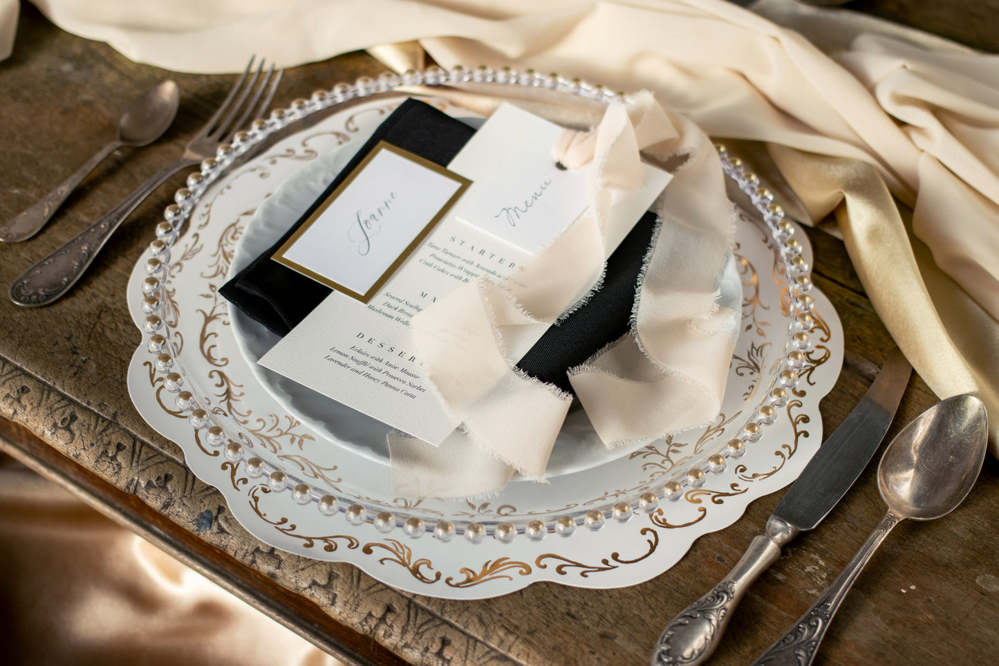 white and gold scalloped placemat