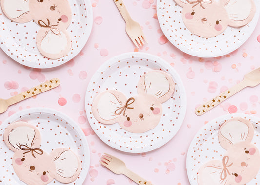 pink party table set up with mouse napkins