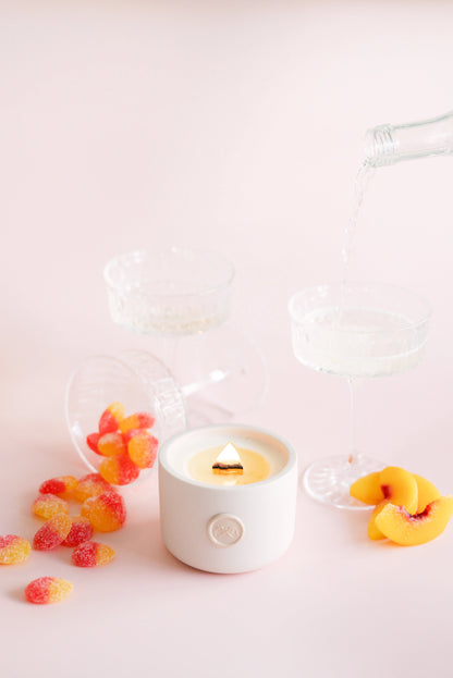 the crush peach and prosecco scented candles