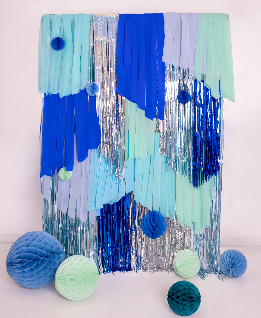 blue and green crepe streamers used to make a backdrop 