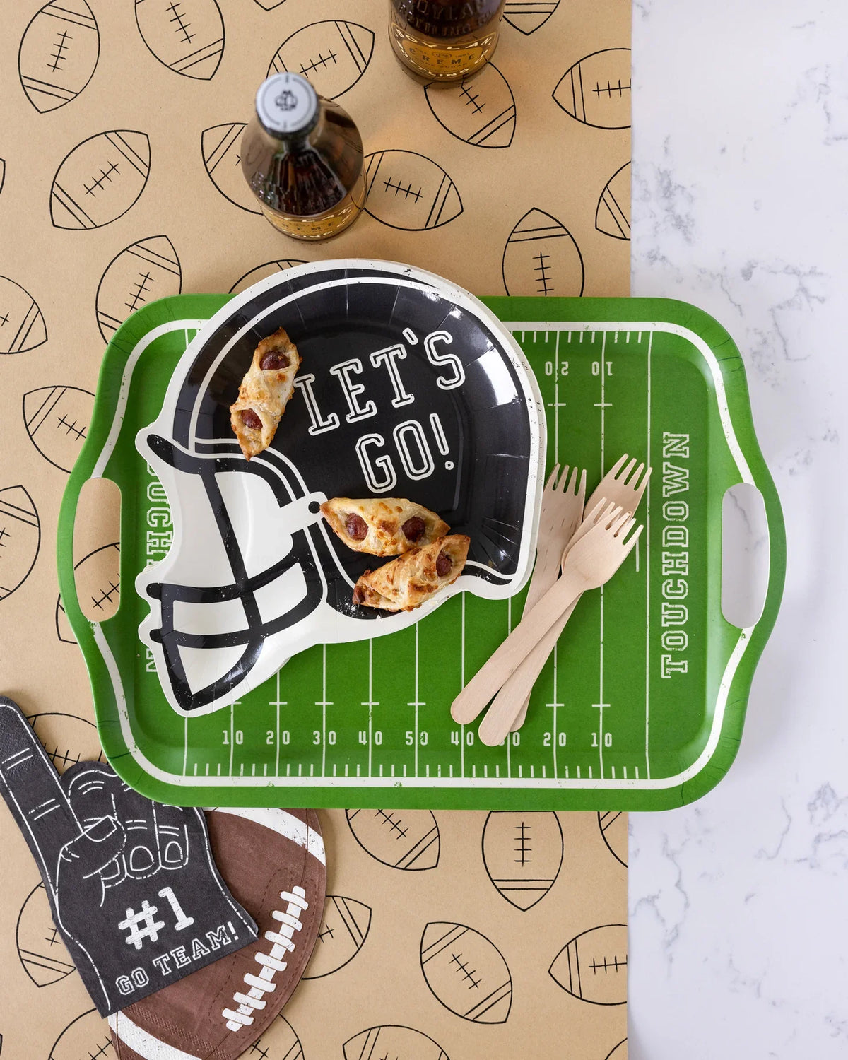 Football field bamboo serving tray styled with game day tableware and snacks, perfect for Toronto parties.