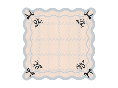 Flat lay of Happy 40 scalloped napkin with pastel plaid pattern and bow detail, ideal for 40th birthday parties in Toronto