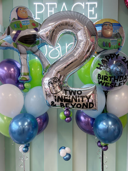Custom silver number balloon with Toy Story theme and Buzz Lightyear balloons available at our Toronto party shop