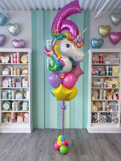 Unicorn birthday balloon bundle with a pink number 6, rainbow unicorn foil balloon, colourful latex balloons and foil star accents in Toronto