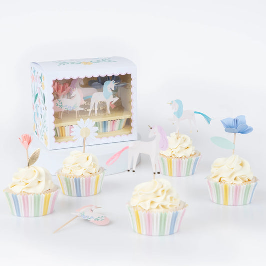 Meri Meri Meadow Unicorn cupcake kit styled with pastel striped liners and unicorn toppers on frosted cupcakes, available at our Toronto party shop.

