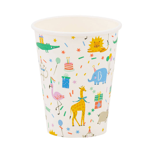 Close-up of a single animal-print paper cup with tiger and giraffe designs, photographed in Toronto.