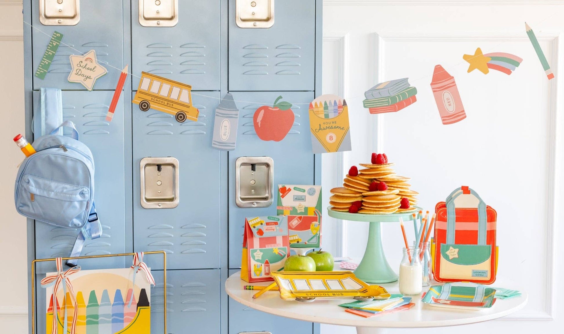 Back to school party setup featuring a colourful school icons banner available in Toronto and shipping across Canada