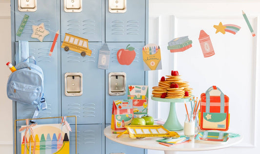 Back to school party setup featuring a colourful school icons banner available in Toronto and shipping across Canada