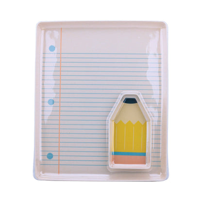 Notebook with a pencil-shaped hole puncher on a white background