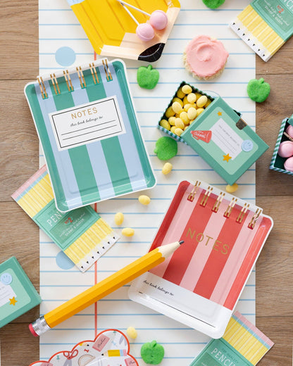 Back to school party setup featuring a notebook paper table runner and school themed decorations available at our Toronto party shop.