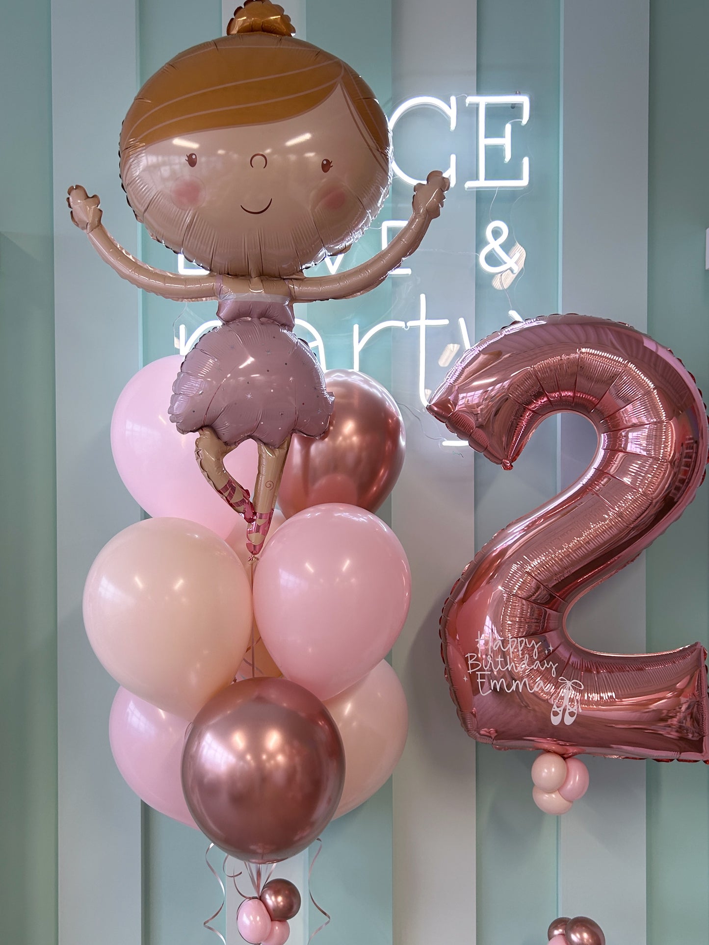 Close-up of ballerina birthday balloons with personalized number available at our Toronto party shop
