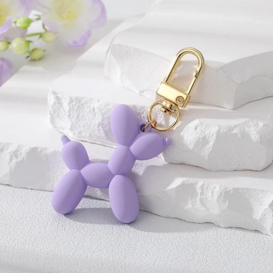 mini balloon dog keychain in a light purple 