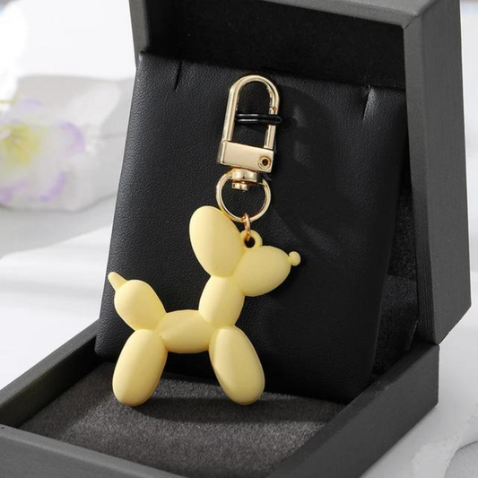 mini balloon dog keychain in a pretty light yellow