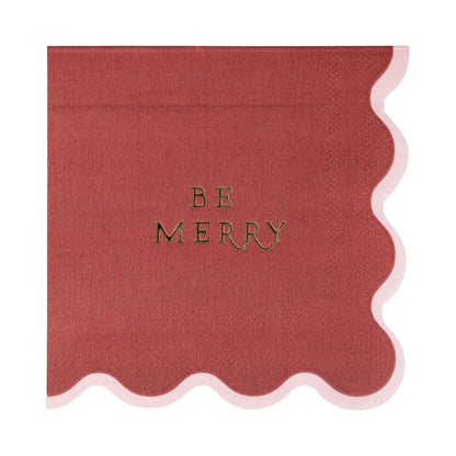 Red 'Be Merry' napkin with scalloped edges and gold foil.