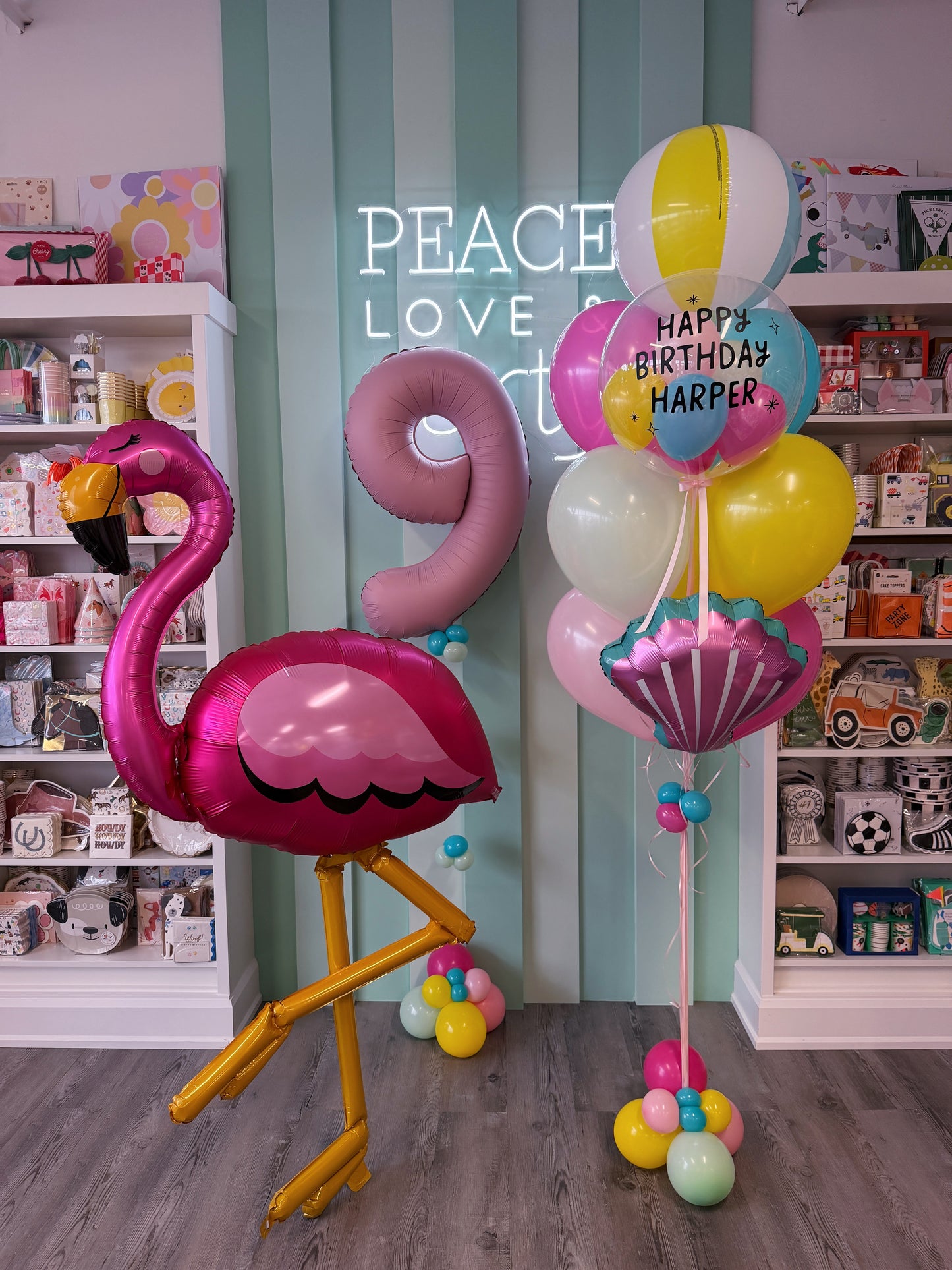 Pink flamingo pool party balloon bundle with beach ball, personalized birthday bubble and colourful balloons in Toronto.