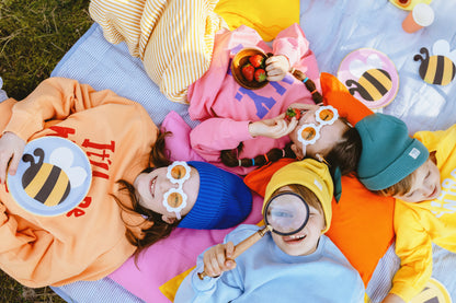 bee shaped napkins with kids having a picnic.