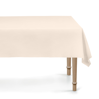 Beige tablecloth on a wooden table with a white background