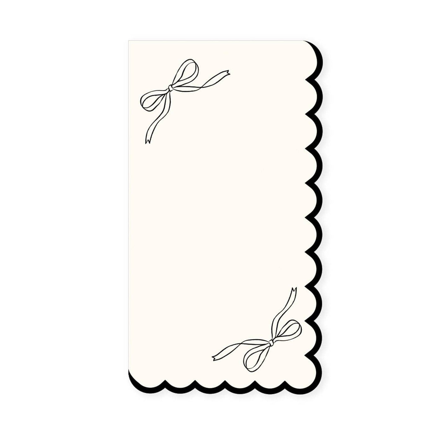 White guest napkin with scalloped edge and black bow details, perfect for elegant bridal showers and parties in Toronto.