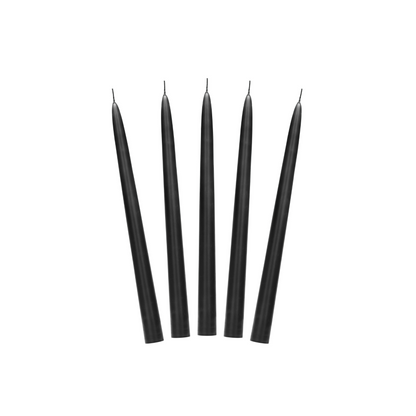 Set of five matte black taper candles with long slim shape, unlit and arranged upright.