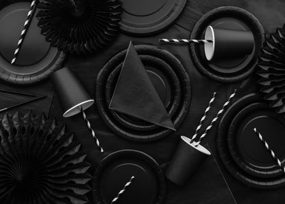 All-black party tablescape with matching plates, cups, straws, and décor, styled by Confetti My Party Toronto