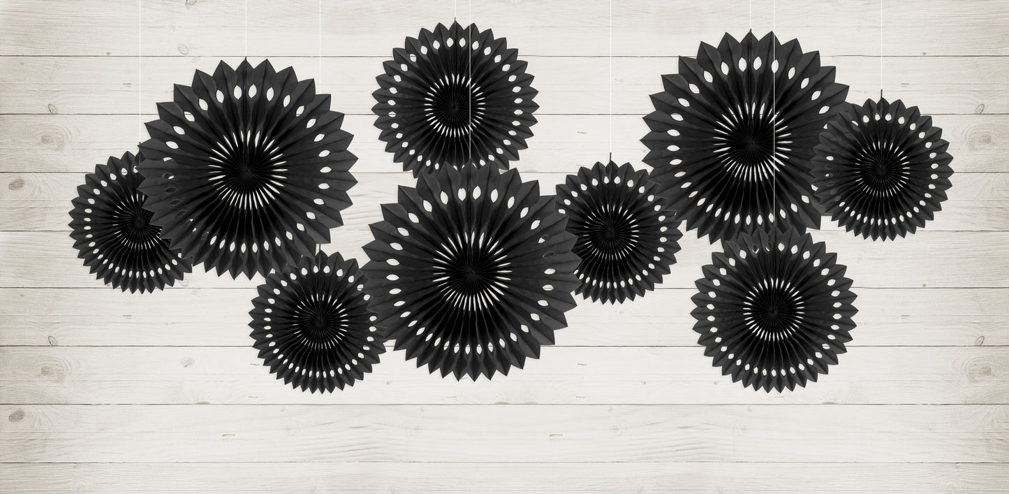Black rosette backdrop decor arranged on a wall available at our Toronto party shop